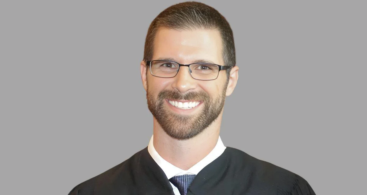 Joshua M. Divine, U.S. District Judge