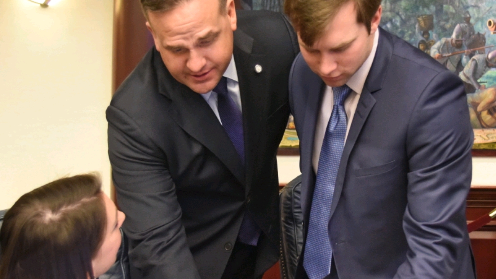 Rep. Jennifer Sullivan (R-Eustis), Rep. Frank Artiles (R-Miami) and Rep. Jay Trumbull (R-Panama City) confer on the House floor in 2016. - Wikimedia Commons