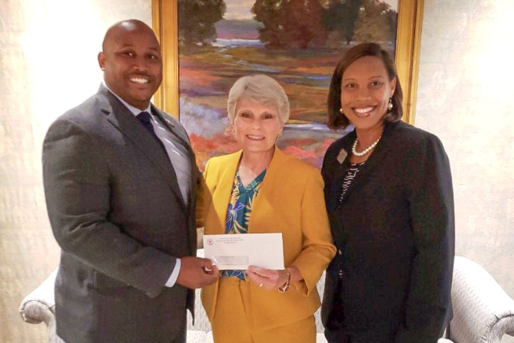 Omega Psi Phi donates scholarship funds to Valley Street Campus