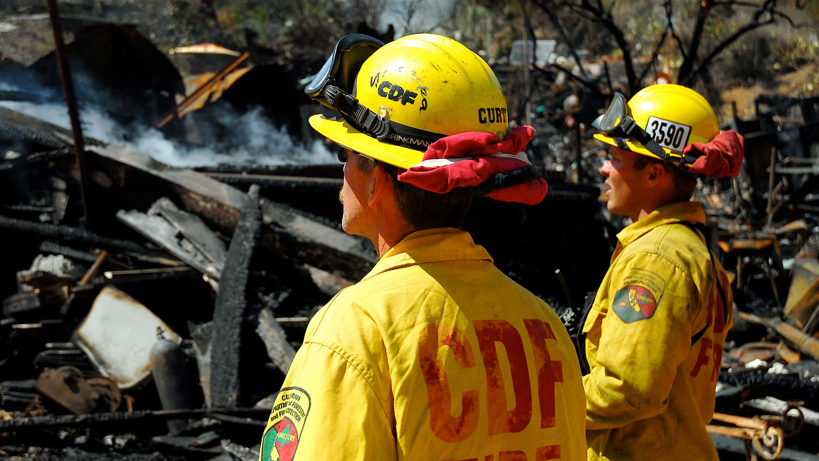 Wildfires like the one that ravaged this business on Catalina Island surveyed by U.S. Navy firefighters assigned to the California Department of Forestry and Fire Protection brought Kin to the state.