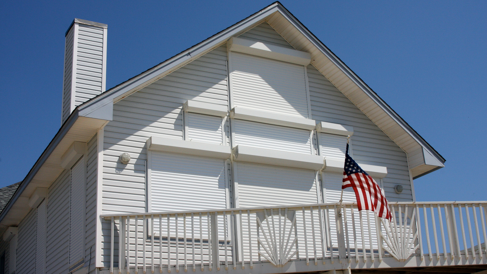 This home survived a hurricane because of mitigation measures, with every window having storm shutters and it was raised on stilts. - By Robert Kaufmann/FEMA