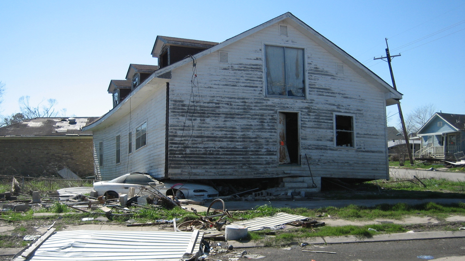 The aftermath of Hurricane Katrina in New Orleans reveals a flood devastated residential section of Lower 9th Ward where a house landed atop Chevy car. - Infrogmation/Wikimedia Commons The aftermath of Hurricane Katrina in New Orleans reveals a flood devastated residential section of Lower 9th Ward where a house landed atop Chevy car. - Infrogmation/Wikimedia Commons