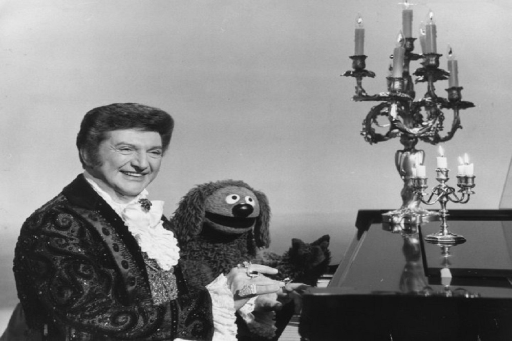 Liberace Displays His Famous Rings at Press Conference