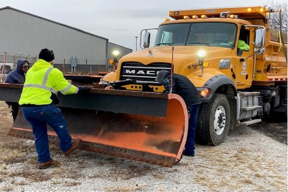 Clay County, Missouri Government – Highway Workers Installed Snow Plows on the Dump Trucks