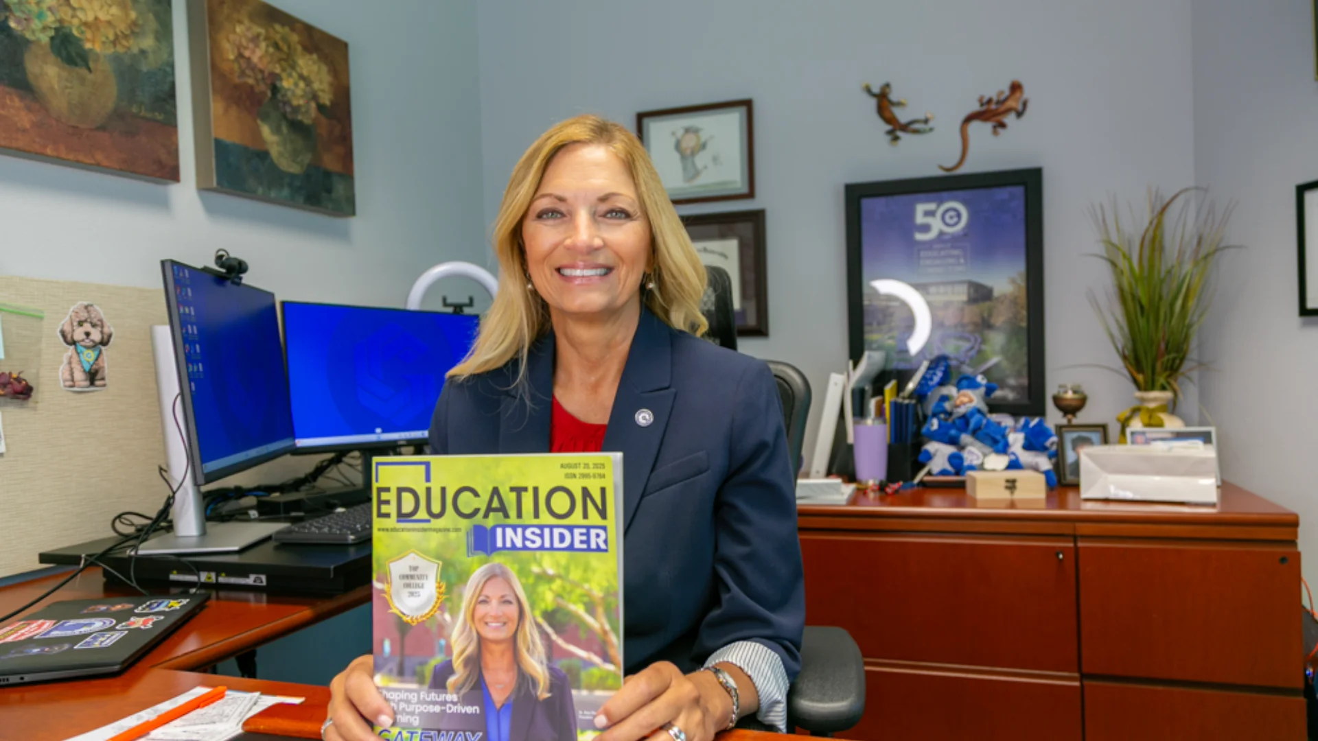 Dr. Amy Diaz, President of GateWay Community College, with the cover of Education Insider magazine announcing GateWay as a Top Community College.