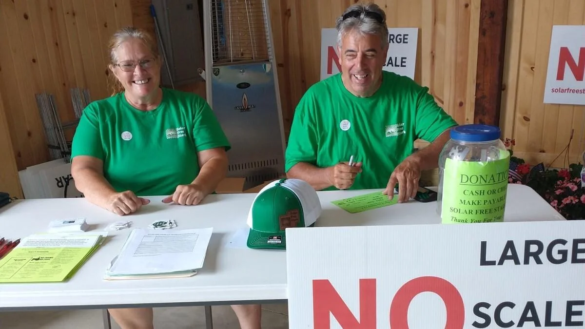 Members of Solar Free Stark participate in a fundraiser for the group last Sunday.