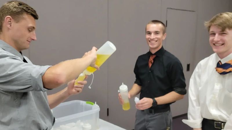 Seminarians in Phoenix help prepare oils that will be consecrated at the Chrism Mass during Holy Week.