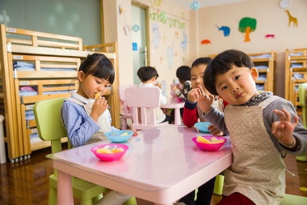 Free to use  Three Toddler Eating on White Table - Naomi Shi