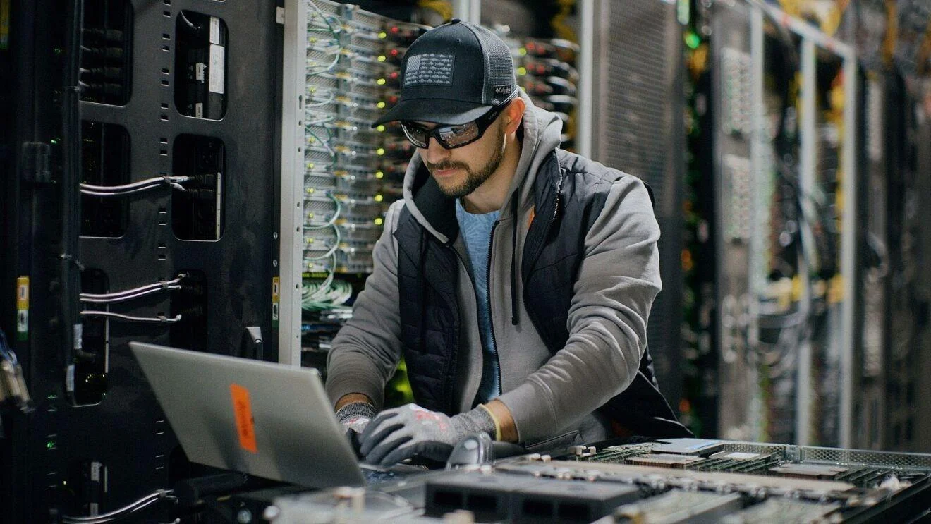 Employee working at an AWS data center - aboutamazon.com