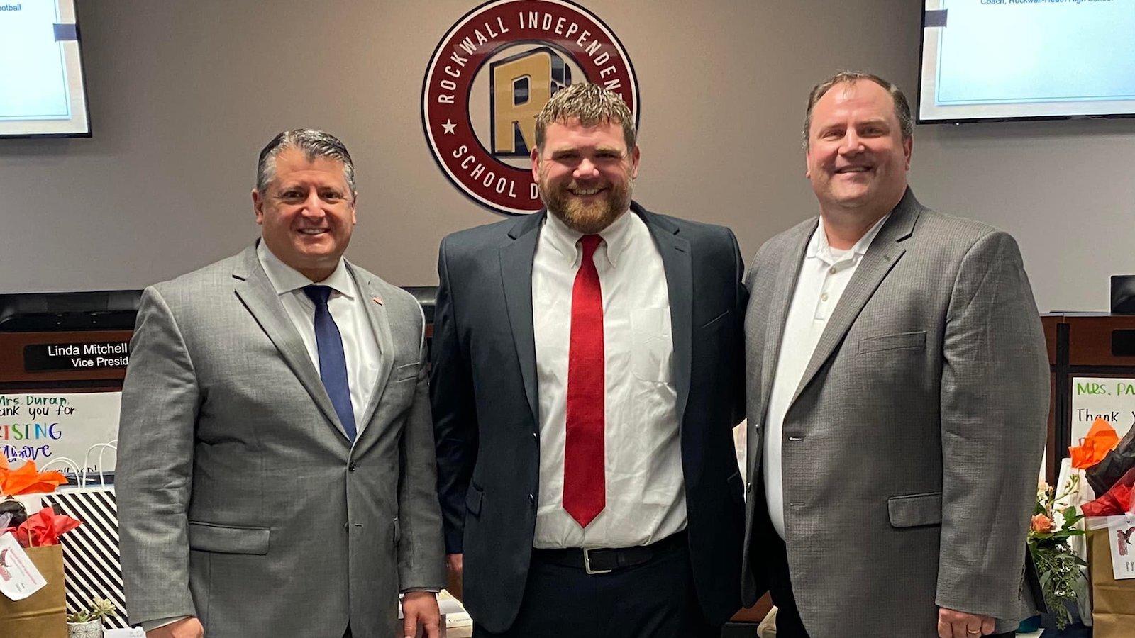 John Harrell (center) is head football coach at Rockwall-Heath High School.