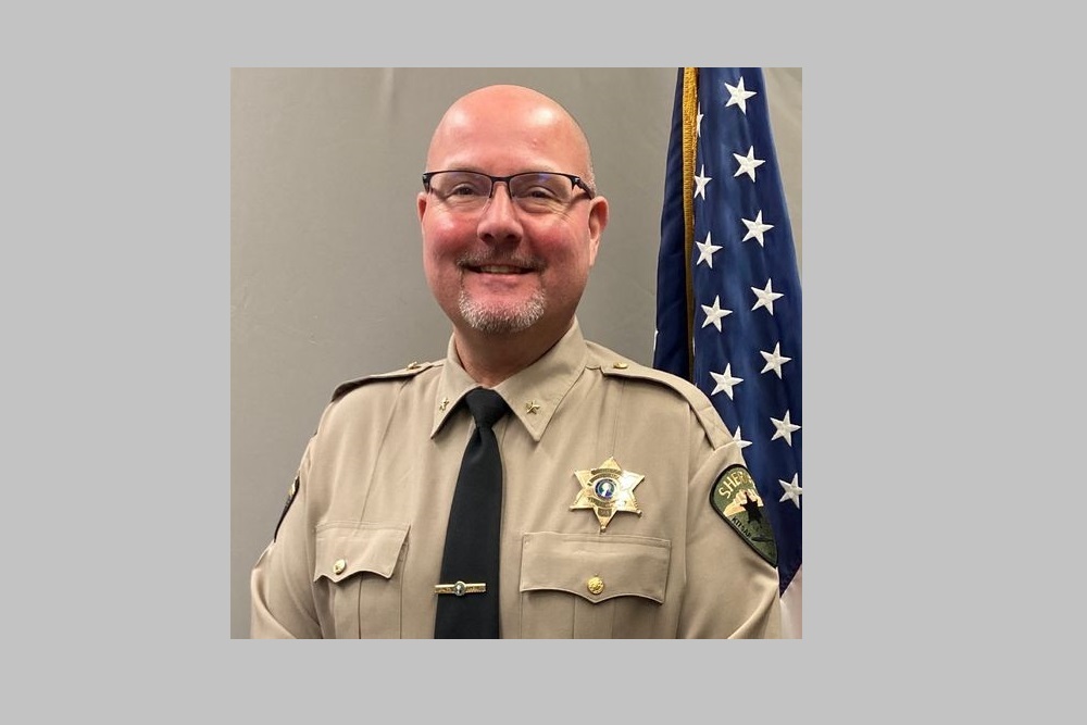 Sheriff John Gese in congratulating Chad Birkenfeld