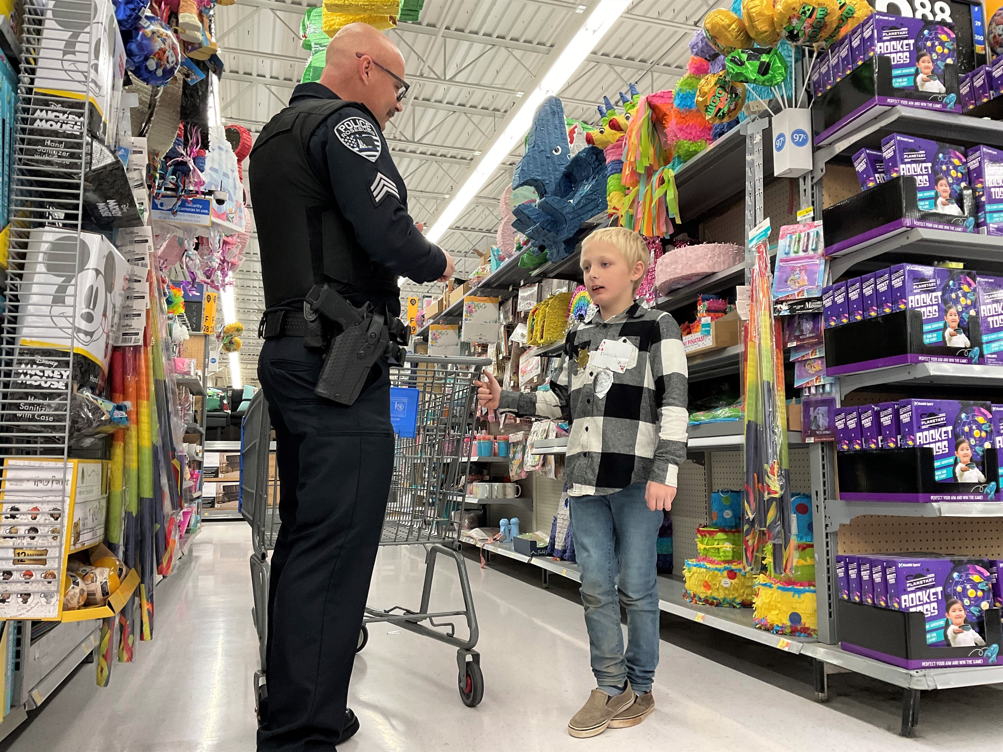 Law enforcement ‘elves’ help kids shop Law enforcement ‘elves’ help kids shop
