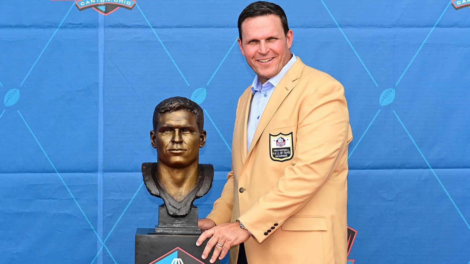 Tony Boselli poses with his bust during an induction ceremony. (AP Photo/David Dermer)
