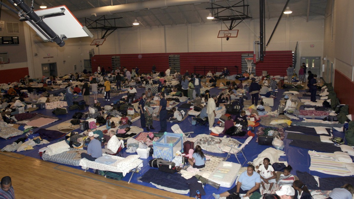 Social distancing and other CDC guidelines won%27t work in a shelter set up like this one for Hurricane Sandy evacuees at West Florida High School - U.S. Navy photo by Photographer%27s Mate 2nd Class Mark A. Ebert