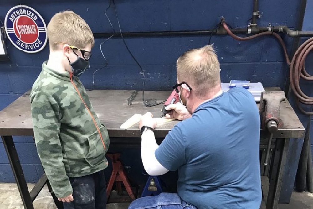 Cub scouts build Pinewood Derby cars at Steve’s Auto Repair