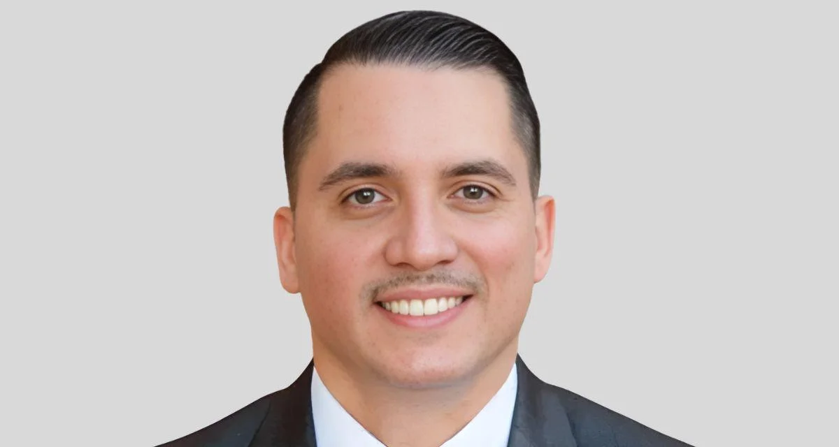 URI professor honored with Outstanding Faculty Award by national education group for excellence in research, teaching and service