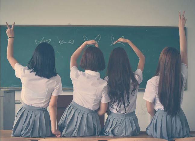 Free to use  Photo of Four Girls Wearing School Uniform Doing Hand Signs