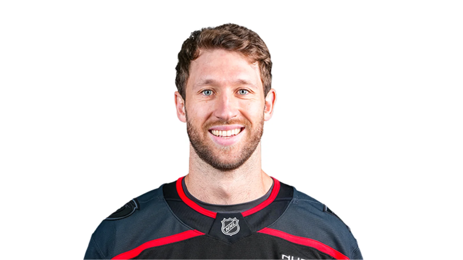 Carolina Hurricanes’ Jaccob Slavin distributes school supplies at community event